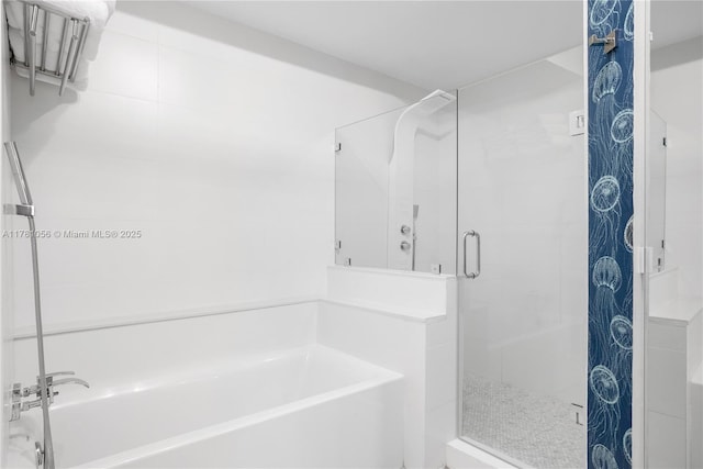 1 Century Ln Unit 309, Miami Beach, FL 33139 - bathroom featuring a shower stall and a garden tub