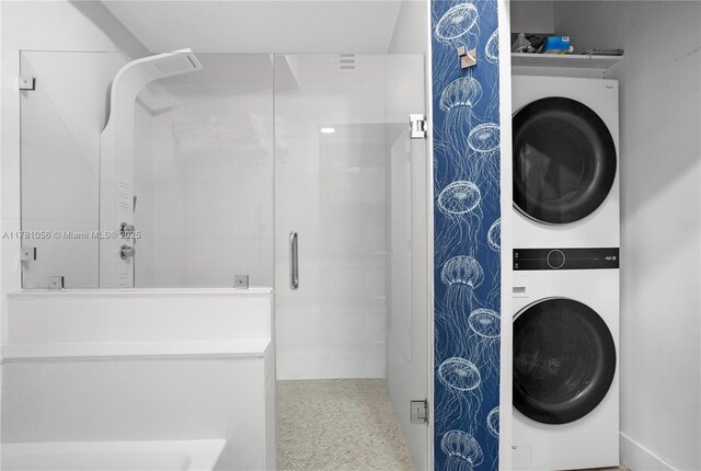 1 Century Ln Unit 309, Miami Beach, FL 33139 - full bathroom with a stall shower and stacked washer and clothes dryer