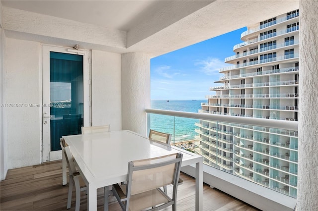 balcony featuring a water view