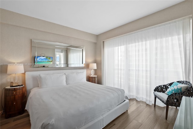 bedroom with wood finished floors