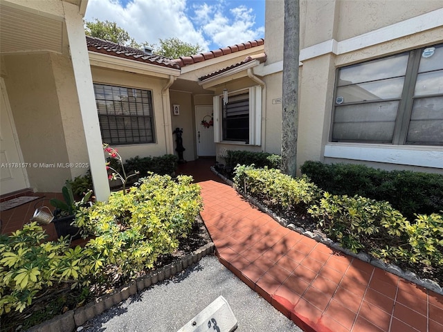 17012 NW 66th Ct, Hialeah, FL 33015 - entrance to property with a tile roof and stucco siding