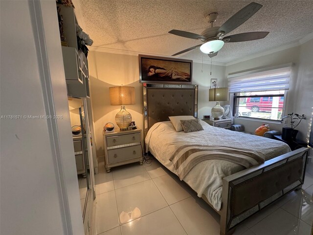 17012 NW 66th Ct, Hialeah, FL 33015 - bedroom featuring a ceiling fan, ornamental molding, a textured ceiling, and light tile patterned flooring