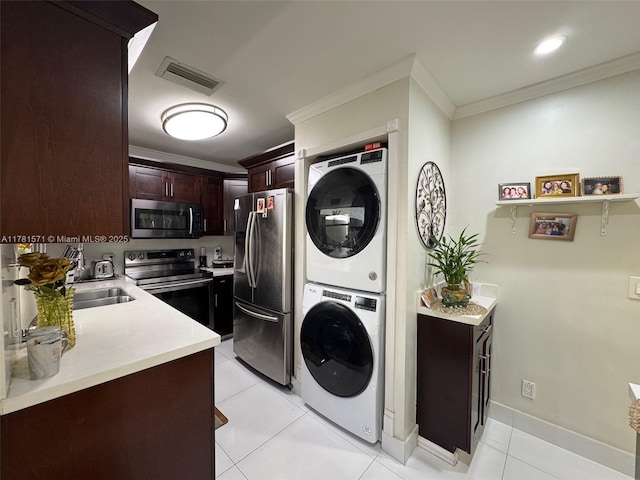 17012 NW 66th Ct, Hialeah, FL 33015 - washroom featuring ornamental molding, stacked washer / dryer, visible vents, and laundry area