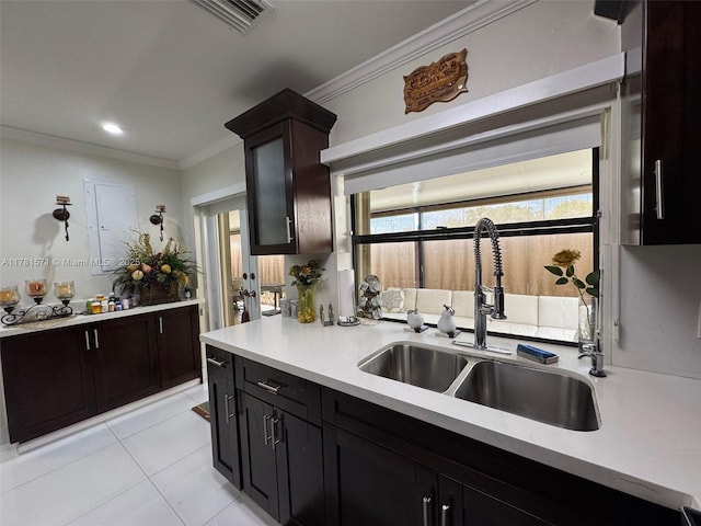 17012 NW 66th Ct, Hialeah, FL 33015 - kitchen with crown molding, a sink, visible vents, and light countertops