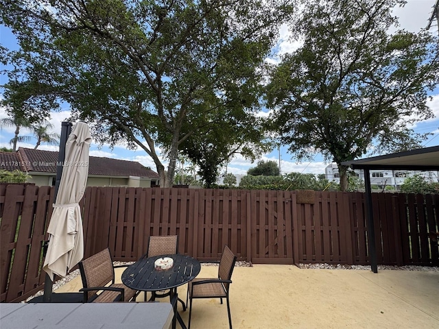 17012 NW 66th Ct, Hialeah, FL 33015 - view of patio / terrace featuring fence and outdoor dining area