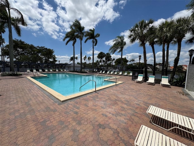 17012 NW 66th Ct, Hialeah, FL 33015 - pool with fence and a patio area
