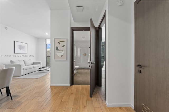 398 NE 5th St Unit 2119, Miami, FL 33132 - hallway featuring baseboards and light wood finished floors