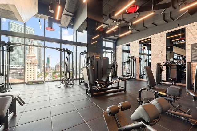 398 NE 5th St Unit 2119, Miami, FL 33132 - gym with expansive windows, a towering ceiling, a view of city, and a healthy amount of sunlight