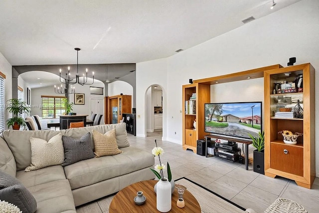 11410 SW 20th St, Miramar, FL 33025 - living area featuring arched walkways, a chandelier, and light tile patterned floors