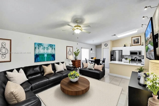 11410 SW 20th St, Miramar, FL 33025 - living room featuring light tile patterned floors, vaulted ceiling, and a ceiling fan