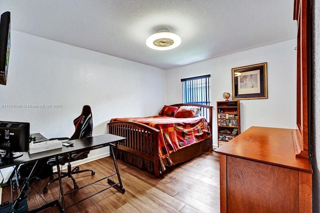 bedroom featuring light wood finished floors