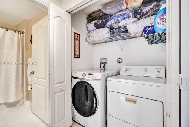 11410 SW 20th St, Miramar, FL 33025 - washroom featuring washer and clothes dryer and light tile patterned floors