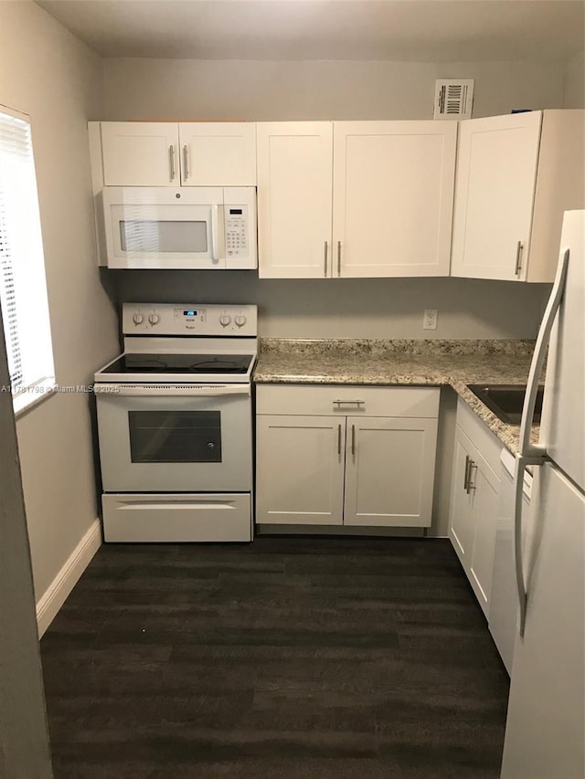 kitchen featuring white cabinets, white appliances, visible vents, and dark wood-style flooring
