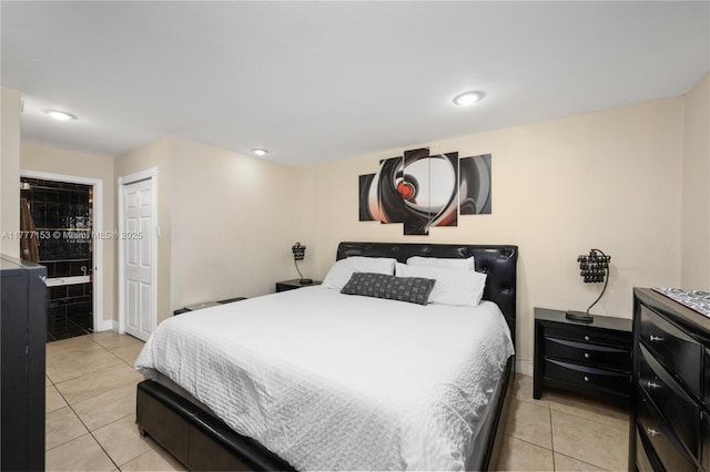 bedroom featuring recessed lighting, baseboards, and light tile patterned flooring