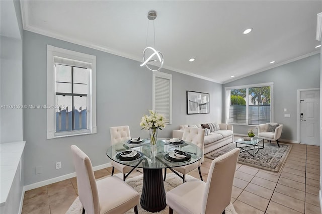 dining room featuring crown molding, light tile patterned flooring, and vaulted ceiling