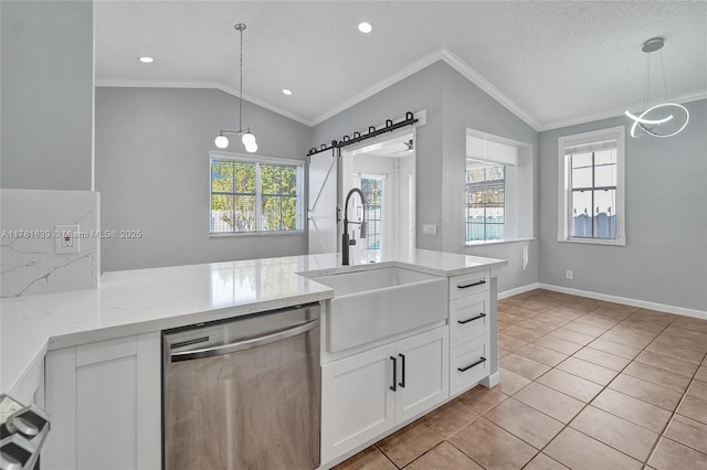 kitchen featuring ornamental molding, dishwasher, a sink, lofted ceiling, and a notable chandelier