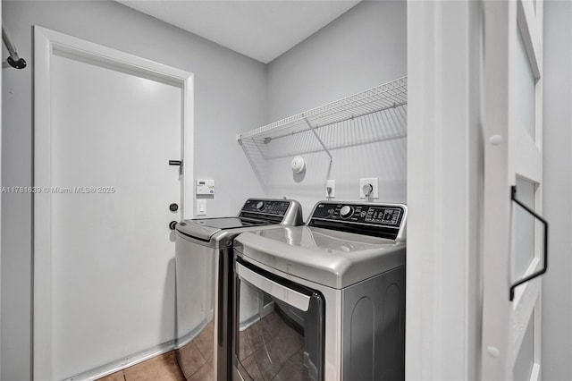 laundry area featuring washer and clothes dryer and laundry area