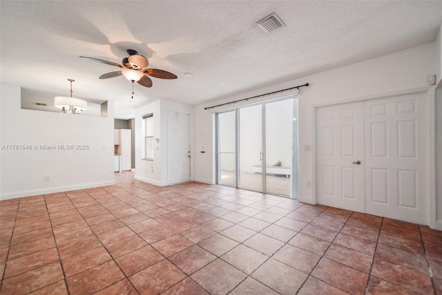 1551 Seagrape Way, Hollywood, FL 33019 - spare room featuring a textured ceiling, visible vents, tile patterned flooring, baseboards, and ceiling fan with notable chandelier