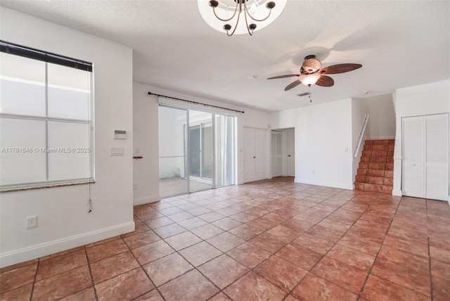 1551 Seagrape Way, Hollywood, FL 33019 - empty room with baseboards, a ceiling fan, and a textured ceiling