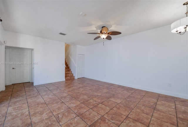 1551 Seagrape Way, Hollywood, FL 33019 - spare room with visible vents, baseboards, ceiling fan with notable chandelier, and stairway