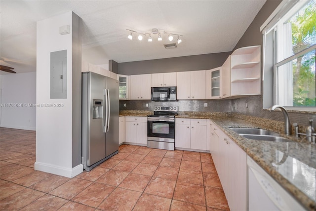 1551 Seagrape Way, Hollywood, FL 33019 - kitchen featuring visible vents, electric panel, tasteful backsplash, a sink, and stainless steel appliances