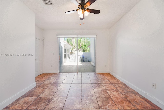 1551 Seagrape Way, Hollywood, FL 33019 - unfurnished room with baseboards, a ceiling fan, a textured ceiling, and visible vents