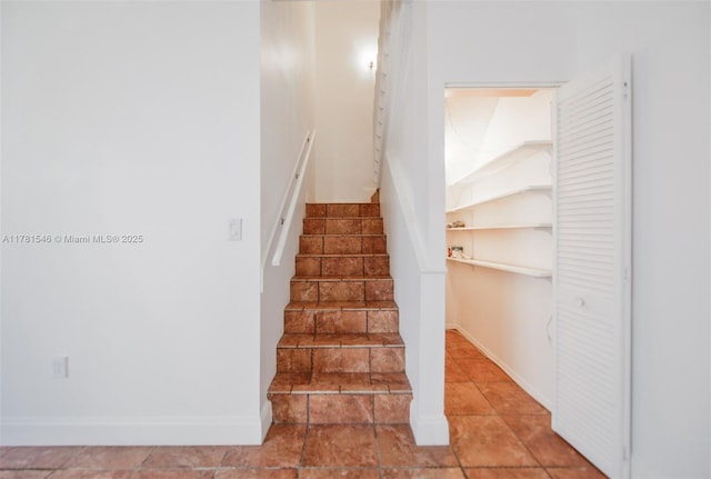 1551 Seagrape Way, Hollywood, FL 33019 - staircase with baseboards and tile patterned flooring