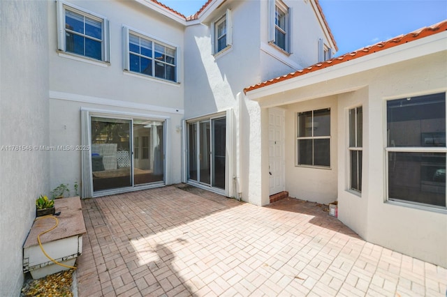 1551 Seagrape Way, Hollywood, FL 33019 - rear view of property with a tiled roof, a patio area, and stucco siding