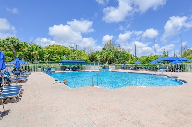 1551 Seagrape Way, Hollywood, FL 33019 - pool with a patio and fence
