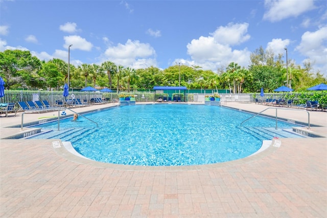 1551 Seagrape Way, Hollywood, FL 33019 - community pool with a patio area and fence