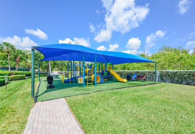 1551 Seagrape Way, Hollywood, FL 33019 - communal playground featuring a yard and fence