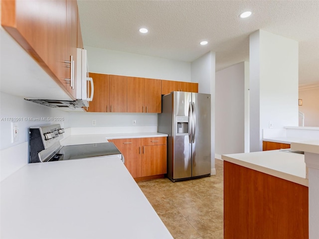 kitchen featuring light countertops, brown cabinetry, and stainless steel appliances
