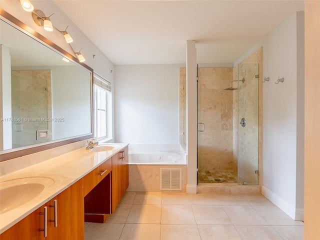 full bath featuring visible vents, a sink, and a shower stall