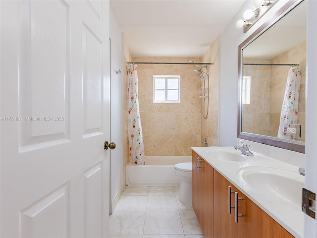 full bathroom with double vanity, shower / tub combo with curtain, toilet, and a sink