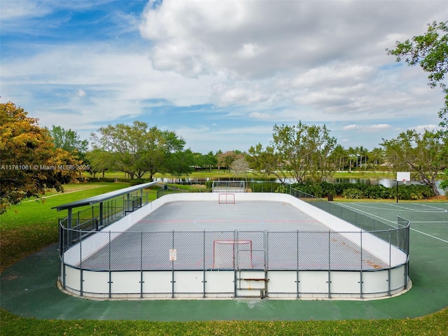 exterior space with community basketball court and fence