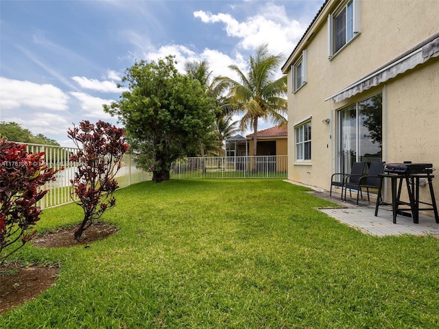 view of yard featuring a patio area and a fenced backyard