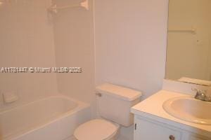 330 Olivewood Pl Unit 217, Boca Raton, FL 33431 - bathroom with vanity, toilet, and shower / washtub combination