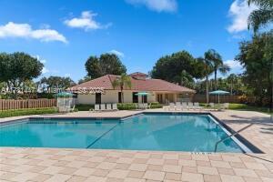 330 Olivewood Pl Unit 217, Boca Raton, FL 33431 - community pool featuring a patio area