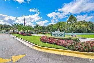330 Olivewood Pl Unit 217, Boca Raton, FL 33431 - view of asphalt road featuring curbs