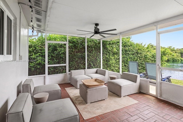 509 NE 29th St, Wilton Manors, FL 33334 - sunroom / solarium featuring a ceiling fan, a water view, and outdoor lounge area