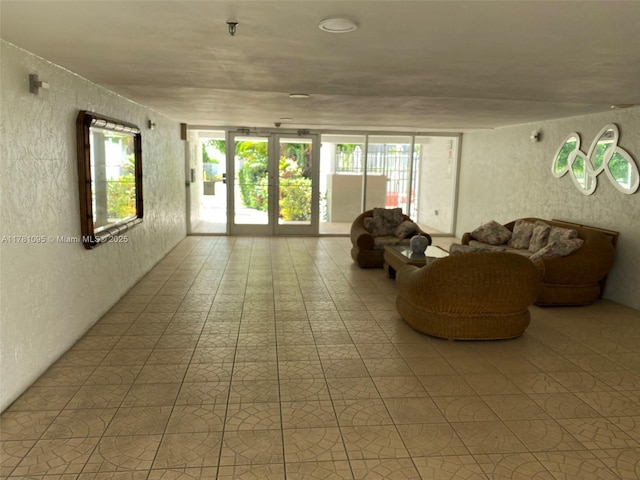 interior space featuring a textured wall and plenty of natural light