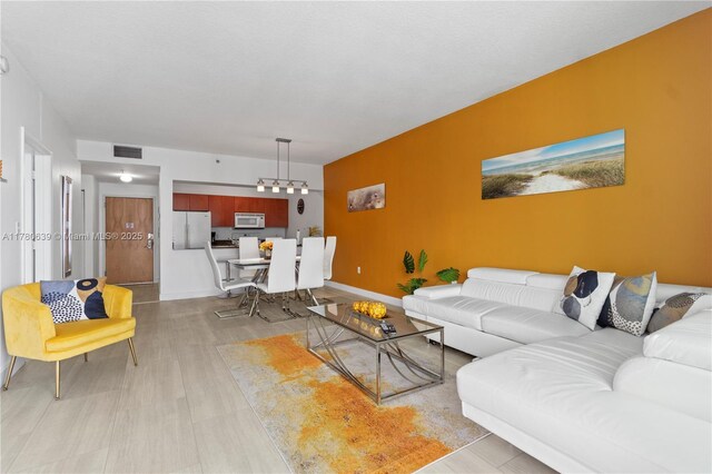 1200 Brickell Bay Dr Ph 4218, Miami, FL 33131 - living room with baseboards