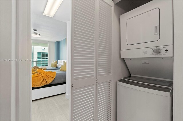 1200 Brickell Bay Dr Ph 4218, Miami, FL 33131 - laundry area with stacked washing machine and dryer