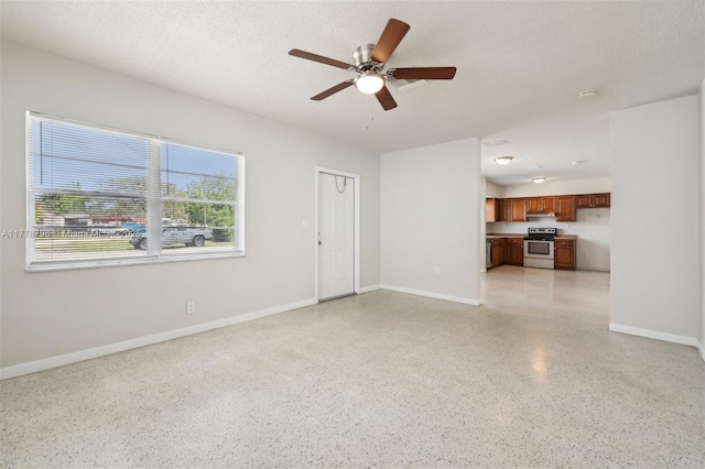 2650 SW 76th Ave, Miami, FL 33155 - unfurnished living room featuring dark speckled floor, ceiling fan, and a textured ceiling