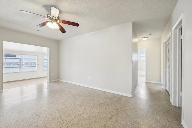 2650 SW 76th Ave, Miami, FL 33155 - empty room with speckle patterned floor, a ceiling fan, and a textured ceiling