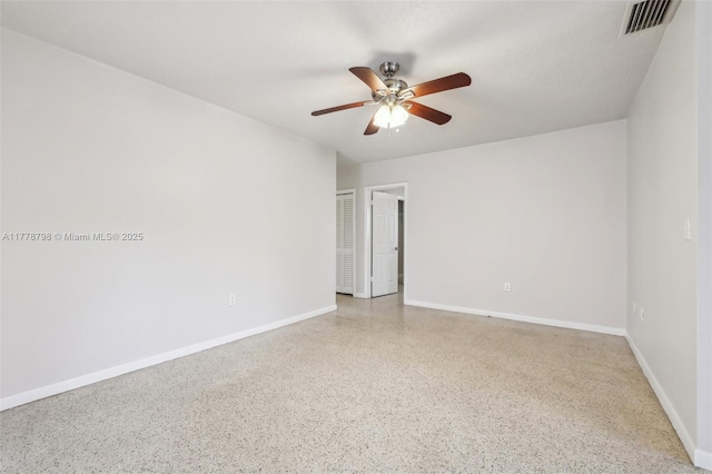 2650 SW 76th Ave, Miami, FL 33155 - empty room featuring speckle patterned floor and ceiling fan