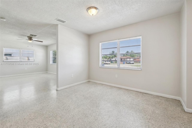 2650 SW 76th Ave, Miami, FL 33155 - empty room with a textured ceiling, speckle patterned floor, and ceiling fan