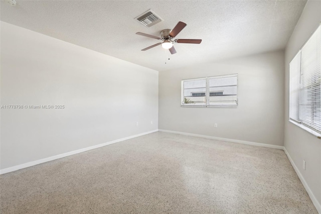 2650 SW 76th Ave, Miami, FL 33155 - spare room with ceiling fan, dark speckled floor, and a textured ceiling