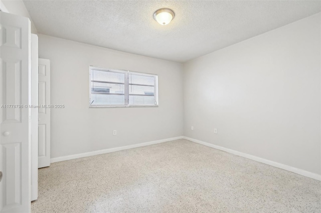 2650 SW 76th Ave, Miami, FL 33155 - spare room with a textured ceiling and speckle patterned floor