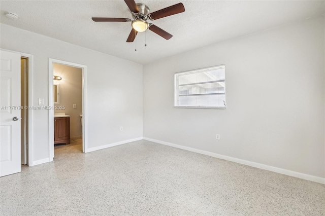 2650 SW 76th Ave, Miami, FL 33155 - unfurnished room with dark aggregate flooring, a smoke detector, and a ceiling fan
